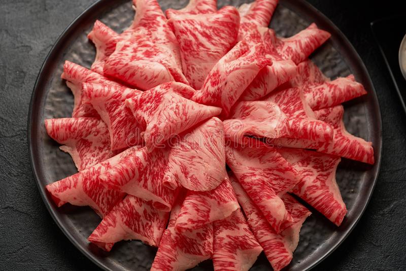 close-up-detailed-image-sliced-japanese-wagyu-beef-ceramic-plate-prepared-shabu-shab-close-up-detailed-image-129069320.jpg