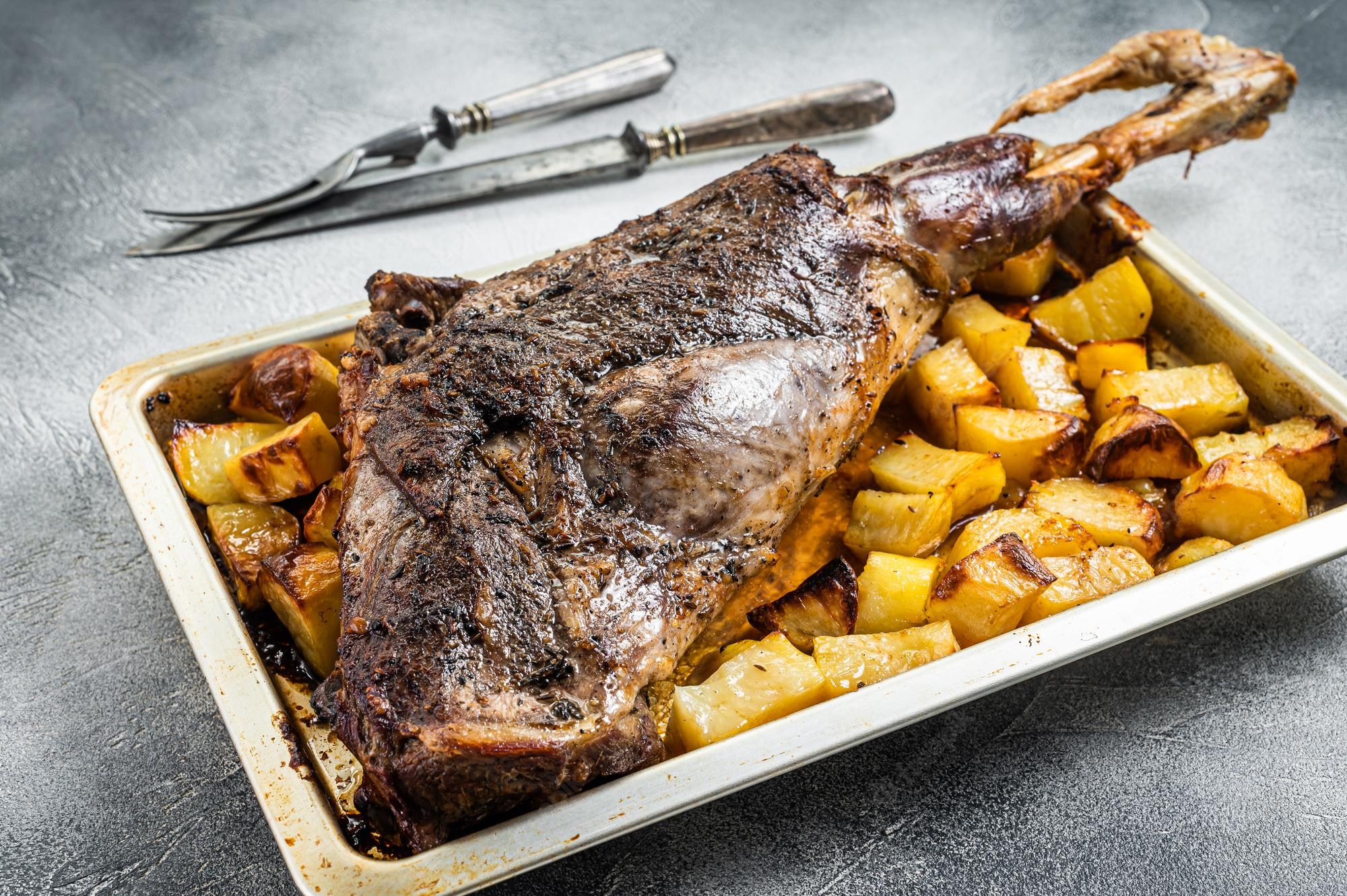 roast-lamb-mutton-leg-with-potatoes-rosemary-baking-dish-white-background-top-view_89816-37769.jpg