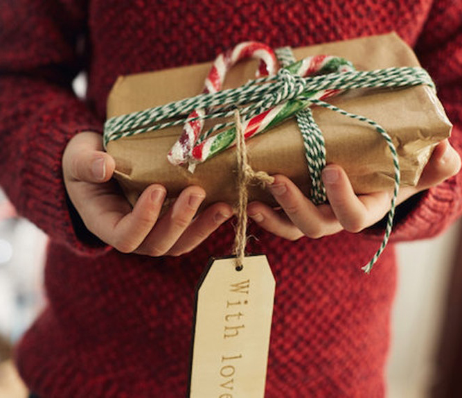 person-holding-christmas-gift_1.jpg