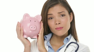 stock-footage-sad-woman-doctor-holding-piggy-bank-in-expensive-health-care-concept-video-multiracial-young.jpg