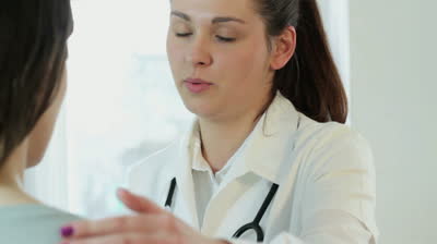 stock-footage-young-sad-female-doctor-comfort-patient.jpg