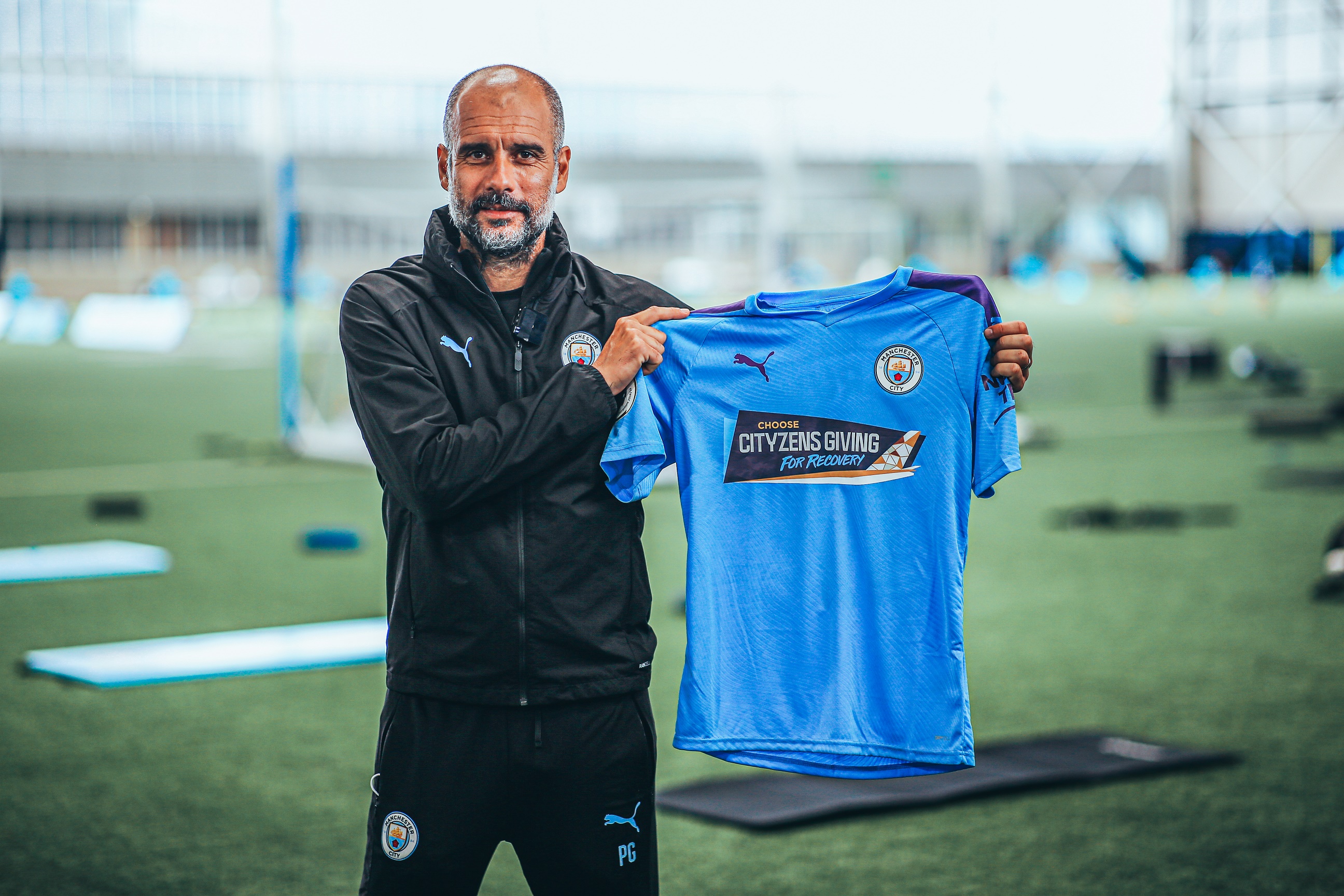 cityzens-giving-pep-guardiola-with-home-shirt.jpg