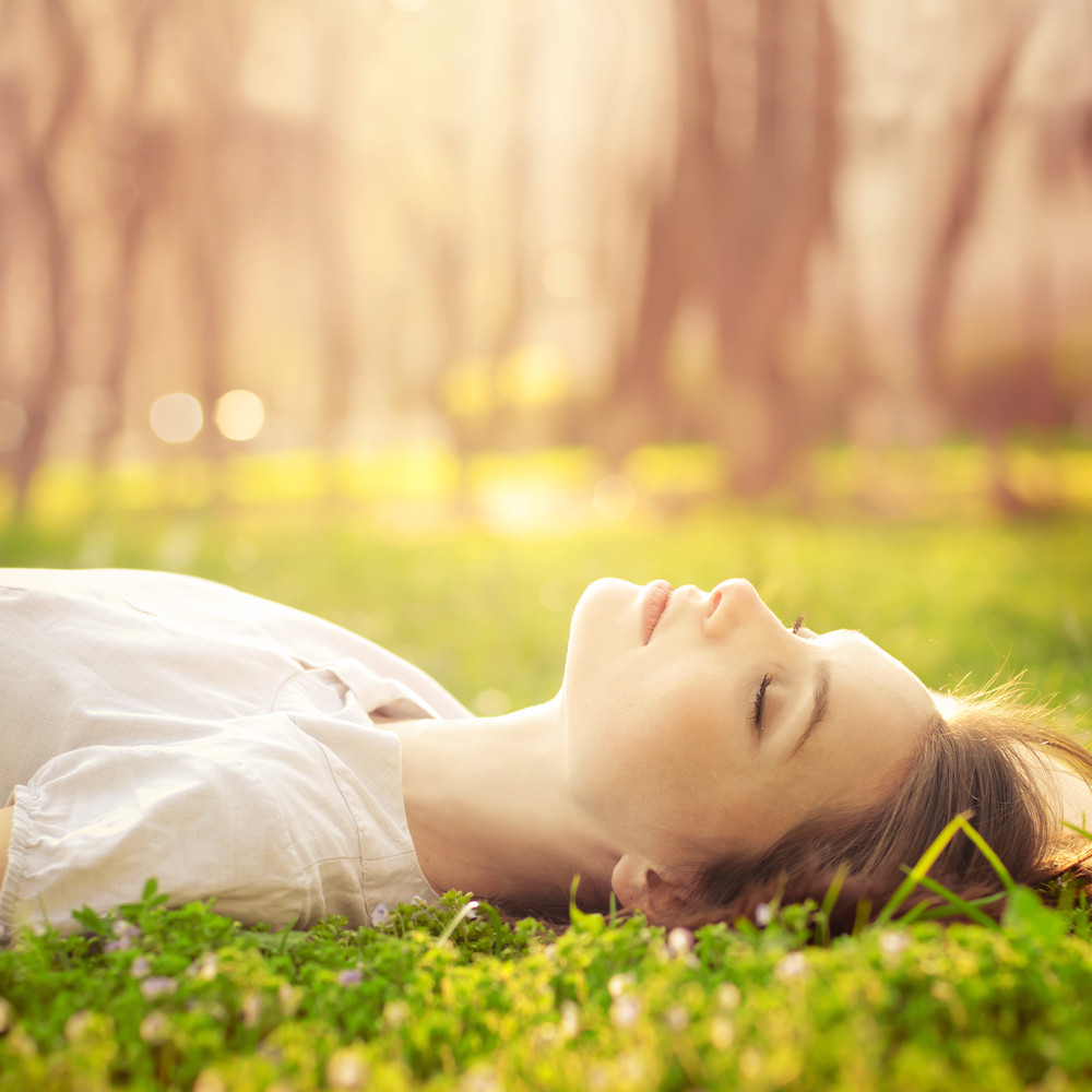 girl-sleeping-in-grass-w-sun.jpg