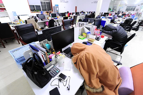 depositphotos_234218512-stock-photo-chinese-employees-take-nap-work.jpg