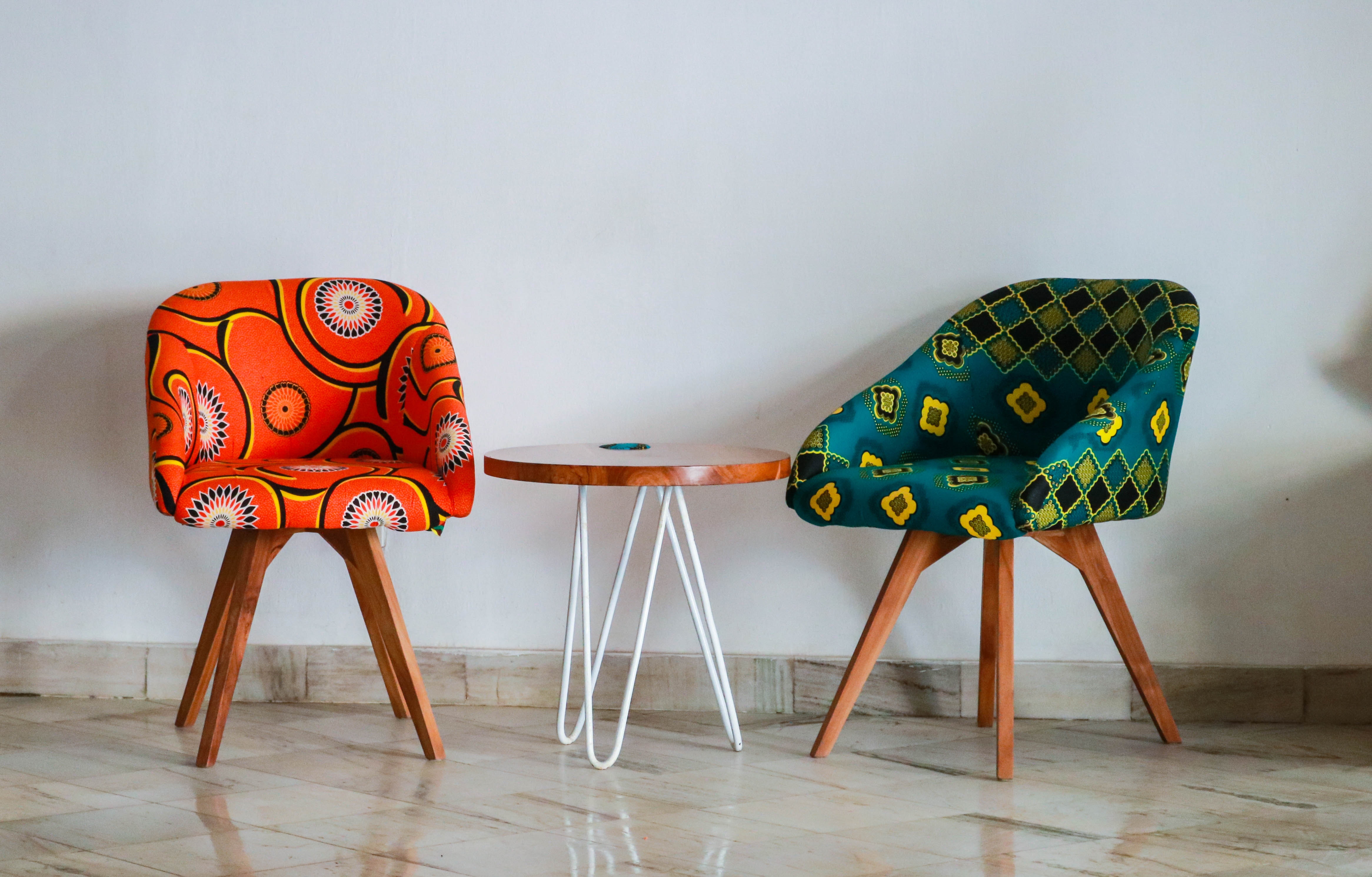 two-assorted-color-padded-chairs-near-side-table-1350789.jpg