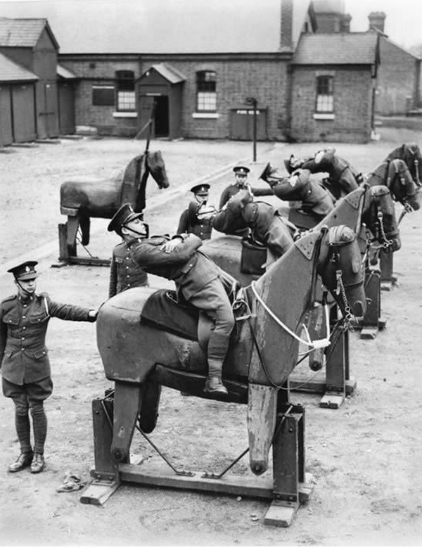 1935_new_recruits_of_the_7th_the_kings_own_hussars_regiment_practice_balancing_on_wooden_horses.jpg