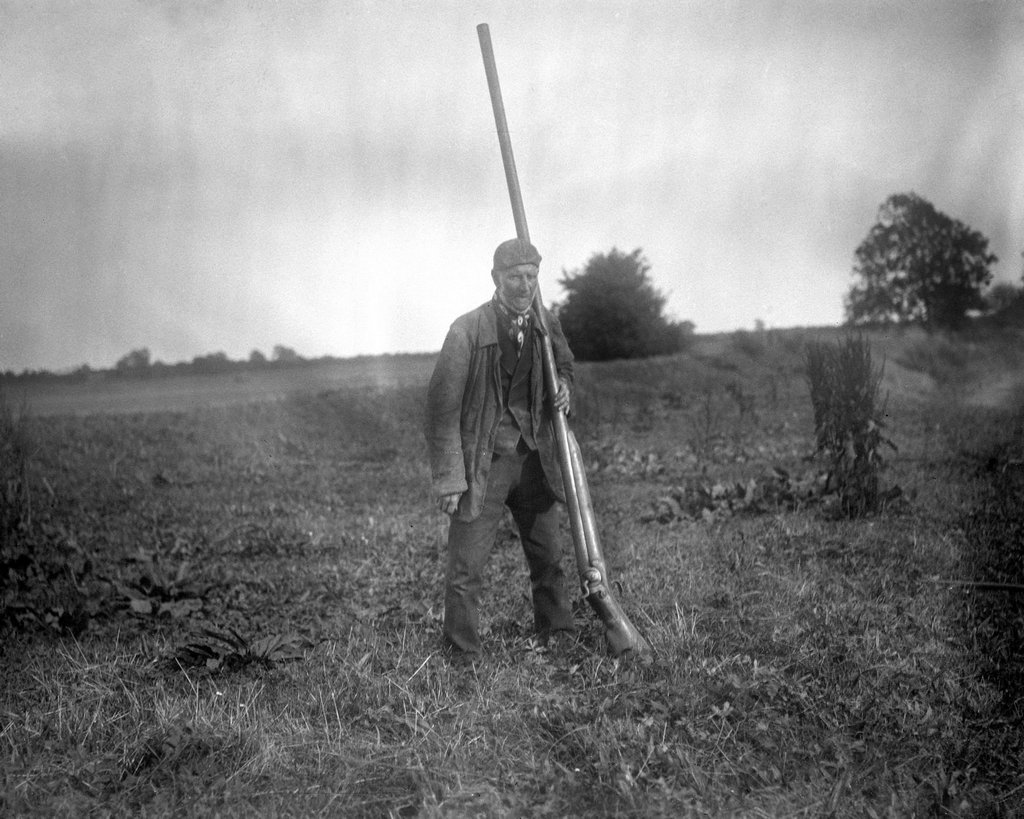 1868_a_man_with_a_punt_gun_a_type_of_large_shotgun_used_for_duck_hunting_it_could_kill_over_50_birds_at_once_and_was_banned_in_the_late_1860s.jpg