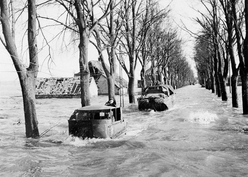 1945_februar_the_main_road_in_kranenburg_on_february_22_1945_amid_four-foot_deep_floods_caused_by_the_bursting_of_dikes_by_the_retreating_germans.jpg