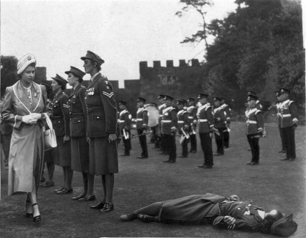 1949_princess_elizabeth_looks_with_concern_at_a_member_of_the_women_s_royal_army_corps_who_had_fainted.jpg