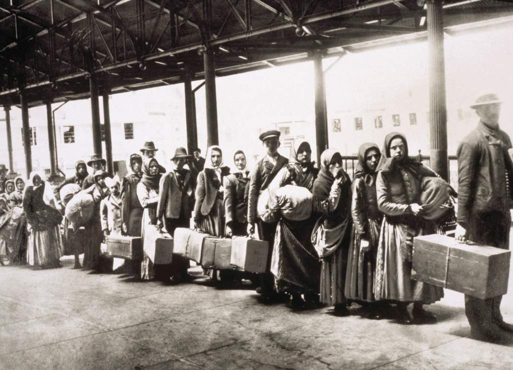 1905_immigrants_at_ellis_island_wait_for_the_ferry_to_take_them_into_new_york.jpg