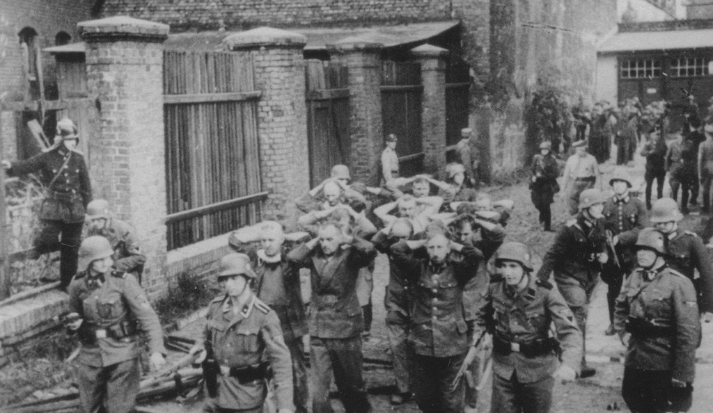 1939_gdansk_1st_september_polish_post_office_workers_being_transporters_by_german_soldiers_after_defending_the_polish_post_office_exec_okt_5.jpg