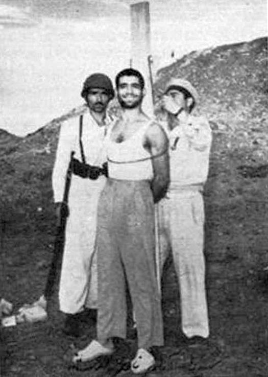 1953_during_the_events_of_the_coup_an_officer_of_iran_navy_is_smiling_right_before_being_executed_tehran.jpg