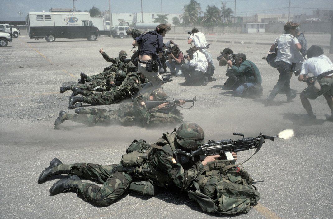 1994_photographers_scramble_in_front_of_us_troops_during_the_1994_invasion_of_haiti.jpg