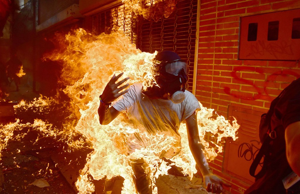 2017_05_03_a_demonstrator_catches_fire_during_clashes_with_riot_police_during_a_protest_against_venezuelan_president_nicolas_maduro_in_caracas.jpg