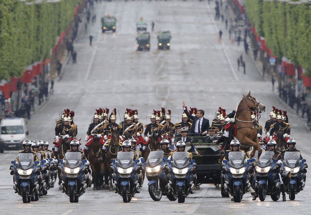 2017_05_14_a_horse_from_the_republican_guard_rears_up_as_newly-elected_french_president_emmanuel_macron_waves_from_a_military_vehicle_while_riding_on_the_champs_elysees.jpg