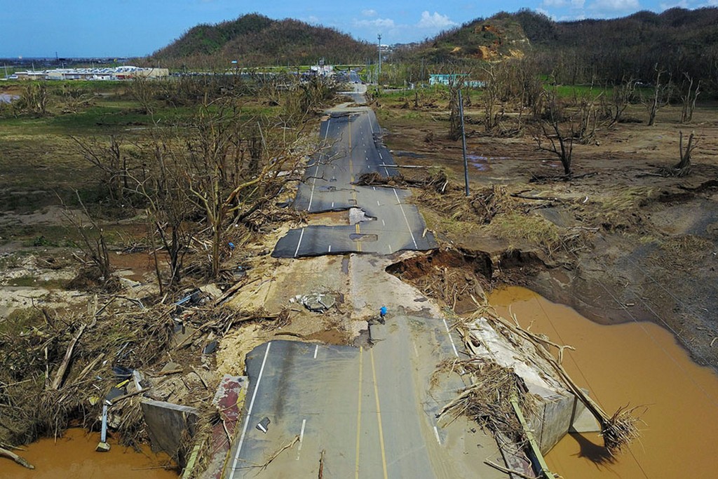 2017_09_28_after_the_passage_of_hurricane_maria_a_man_rides_his_bicycle_on_a_storm-damaged_road_in_toa_alta_west_of_san_juan_puerto_rico.jpg