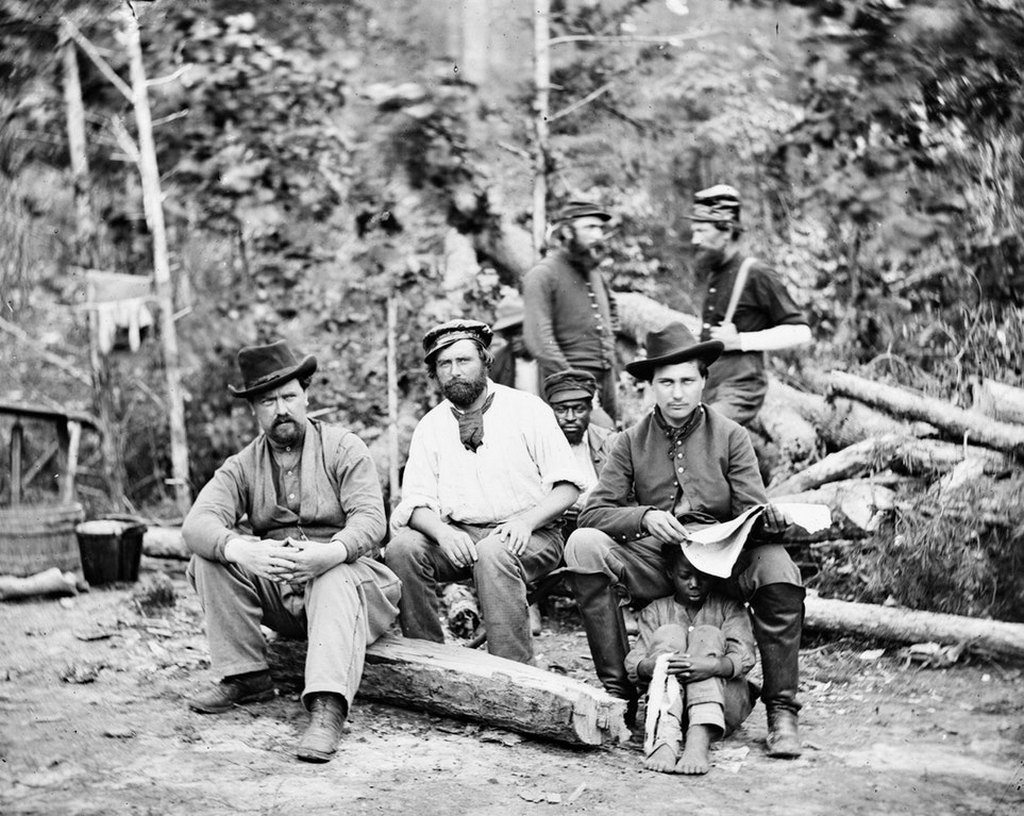 1862_union_soldiers_posing_with_a_escaped_slave_child_in_new_kent_county_virginia.jpg