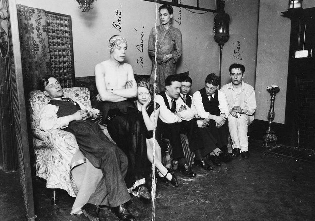 1927_a_photograph_of_eight_people_taken_by_police_during_a_raid_on_a_gay_club_in_fitzroy_square.jpg