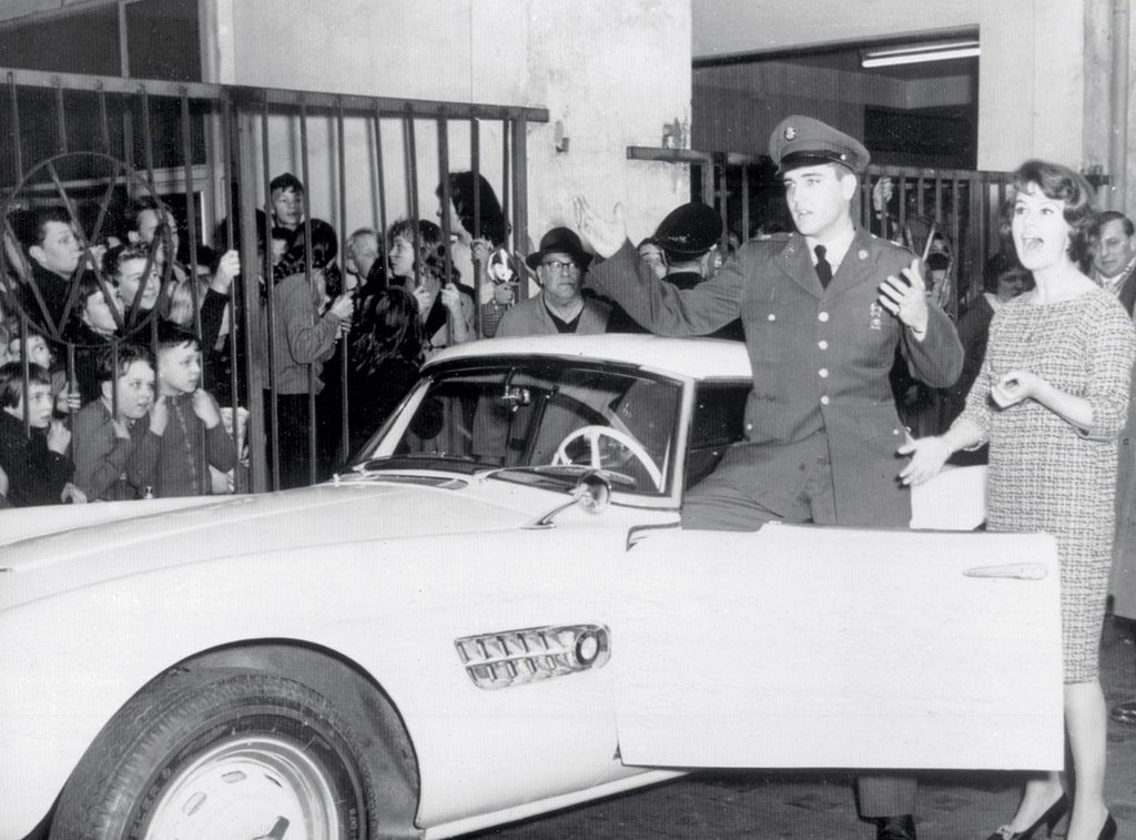 1958_elvis_with_his_bmw_507_and_local_tv_personality_uschi_siebert_in_germany.jpg