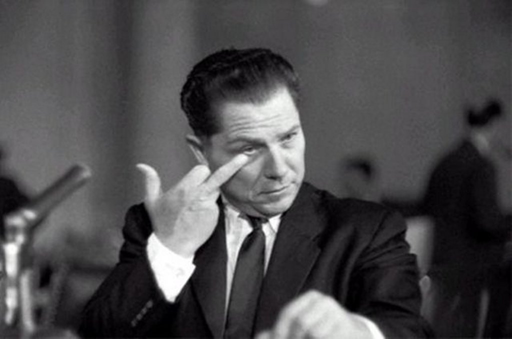 1957_union_boss_jimmy_hoffa_flipping_off_attorney_robert_kennedy_during_a_senate_committee_hearing.jpg