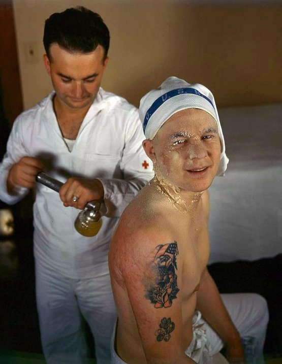 1941_decembere_sailor_being_treated_for_burns_received_during_the_attack_on_pearl_harbor.jpg