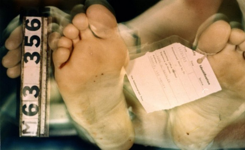 1963_november_lee_harvey_oswald_s_toe-tag_on_the_autopsy_table.jpg