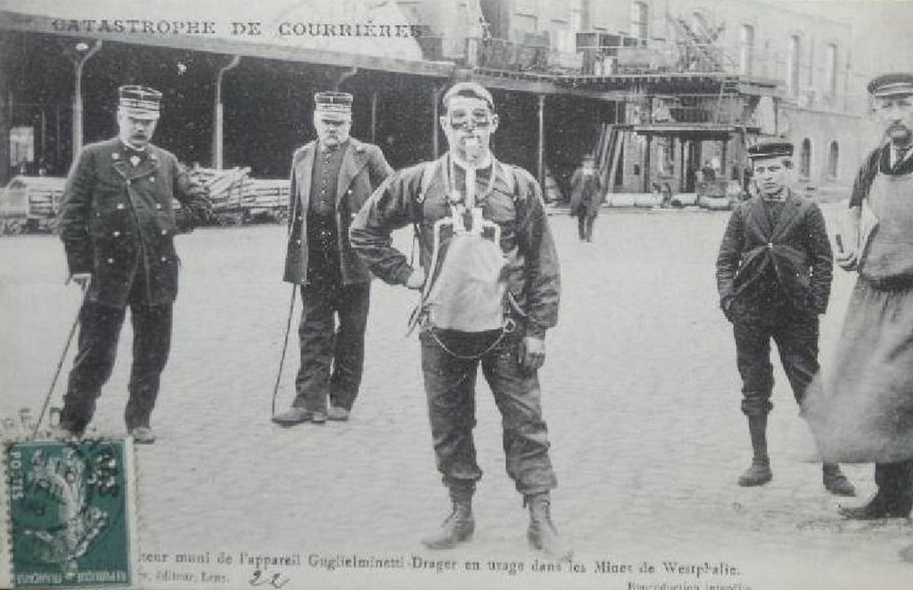 1906_rescue_service_member_with_breathing_equipment_stands_by_during_the_courrieres_mine_disaster_which_caused_the_death_of_1_099_miners_in_northern_france.jpg