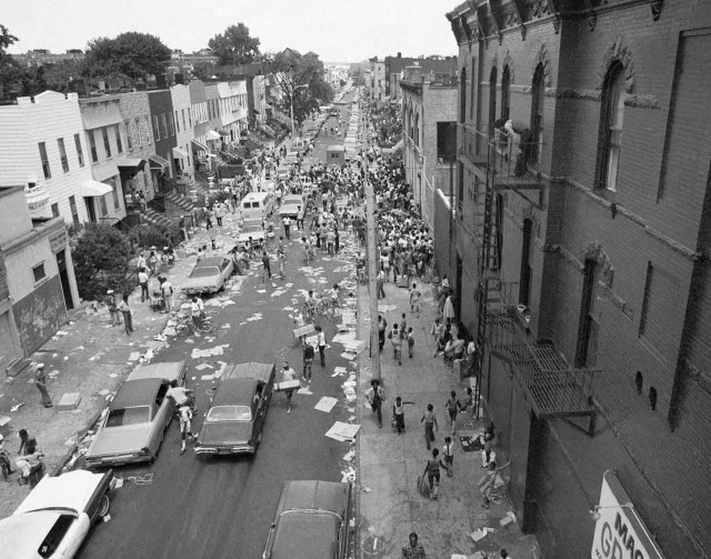 1977_a_street_in_the_bedford-stuyvesant_section_of_brooklyn_is_full_of_people_and_debris_july_14_1977_following_last_night_s_massive_blackout_in_new_york_city.jpg