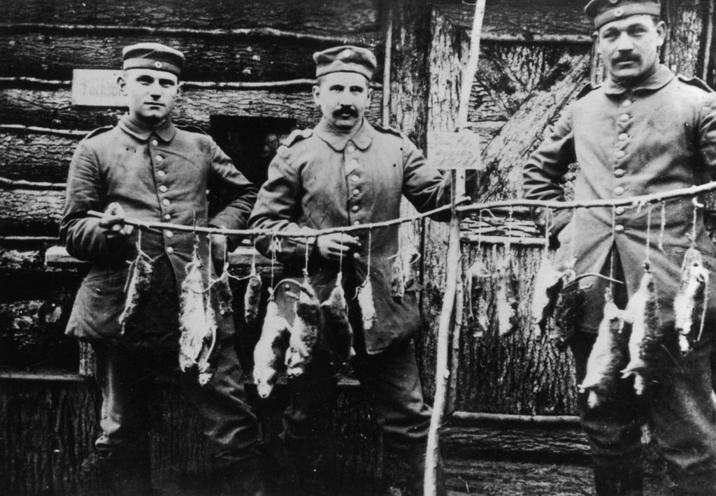 1916_three_german_soldiers_display_rats_killed_in_their_trench_the_previous_night.jpeg