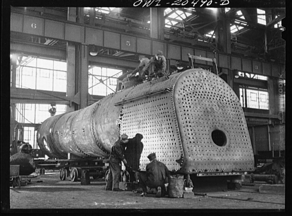 1943_the_fire_box_of_an_engine_being_built_in_the_atchison_topeka_and_santa_fe_railroad_locomotive_shop_albuquerque_new_mexico_masolata.jpg