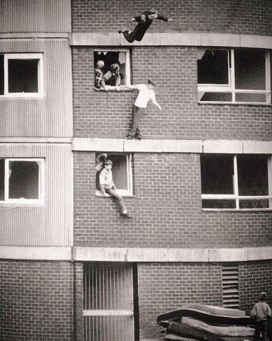 1978_kids_jumping_onto_mattresses_rochdale_england.jpg
