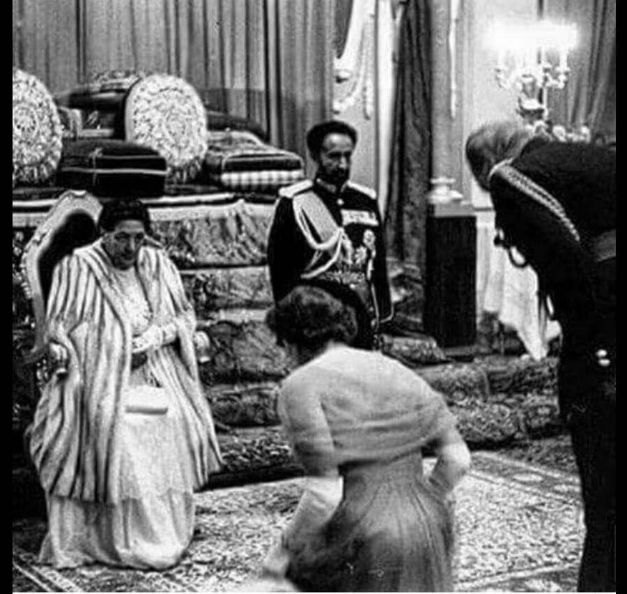 1954_queen_elizabeth_and_prince_phillip_bowing_before_haille_selassie.jpg