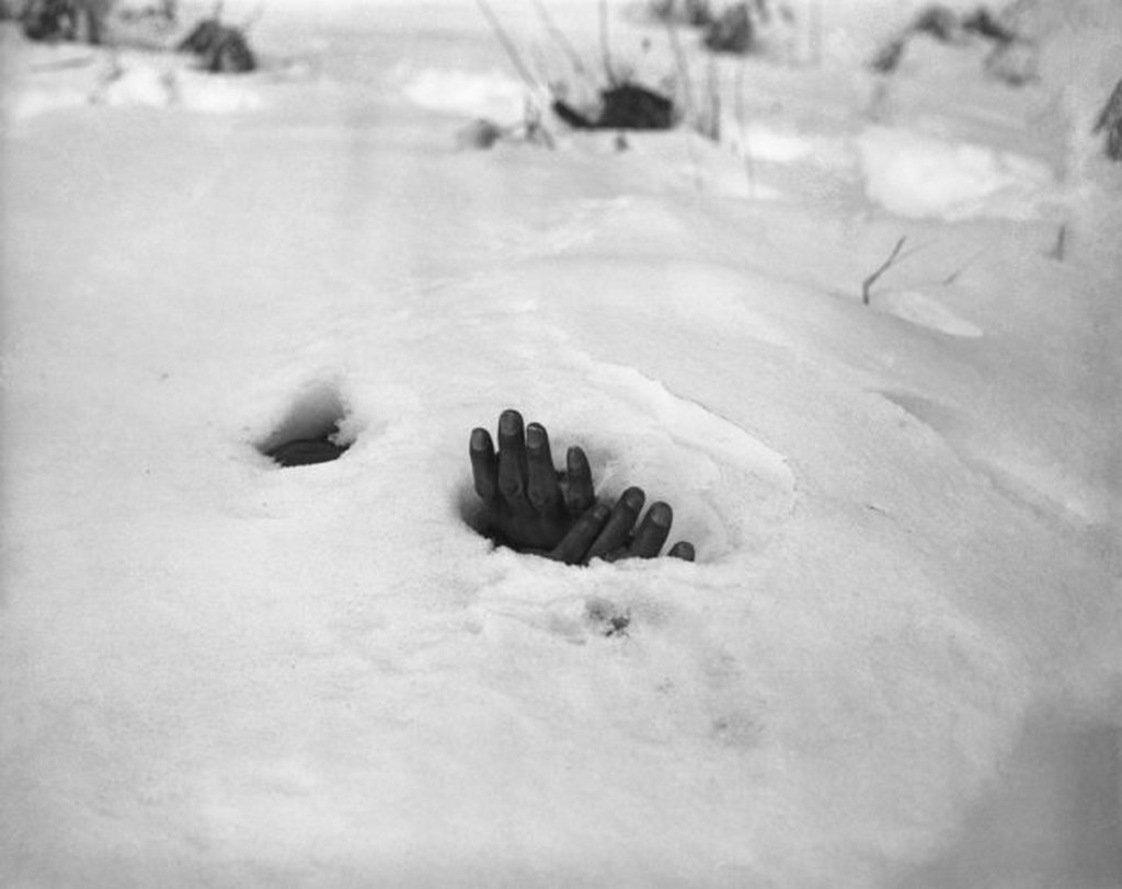 1951_a_pair_of_bound_hands_and_a_breathing_hole_in_the_snow_at_yangji_korea_reveal_the_presence_of_the_body_of_a_korean_civilian_shot_and_left_to_die_by_retreating_communists_during_the_korean_war.jpeg