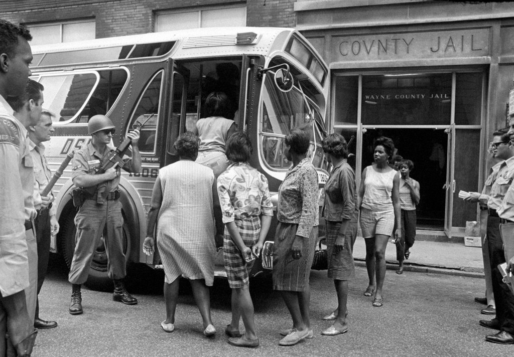 1967_female_prisoners_arrested_during_the_rioting_in_detroit_board_a_bus_at_wayne_county_jail_watched_by_national_guardsmen_for_transfer_to_eloise_a_detention_home_for_women.jpeg