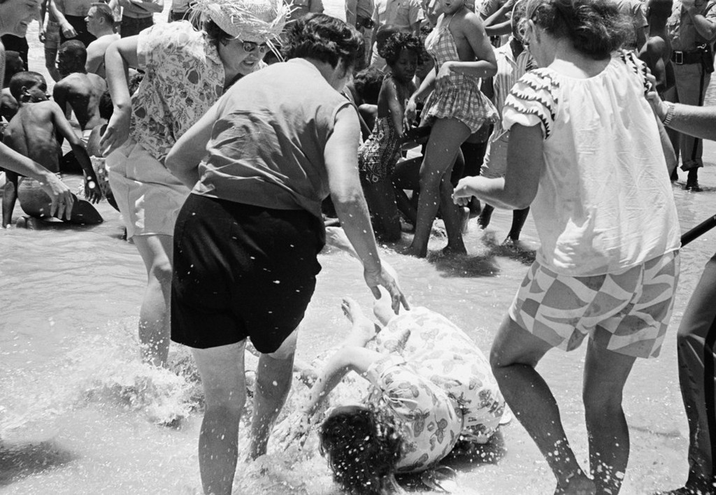 1964_black_woman_attacked_by_three_white_women_segregationists_on_white_only_beach_1964_st_augustine_beach_fla.jpeg