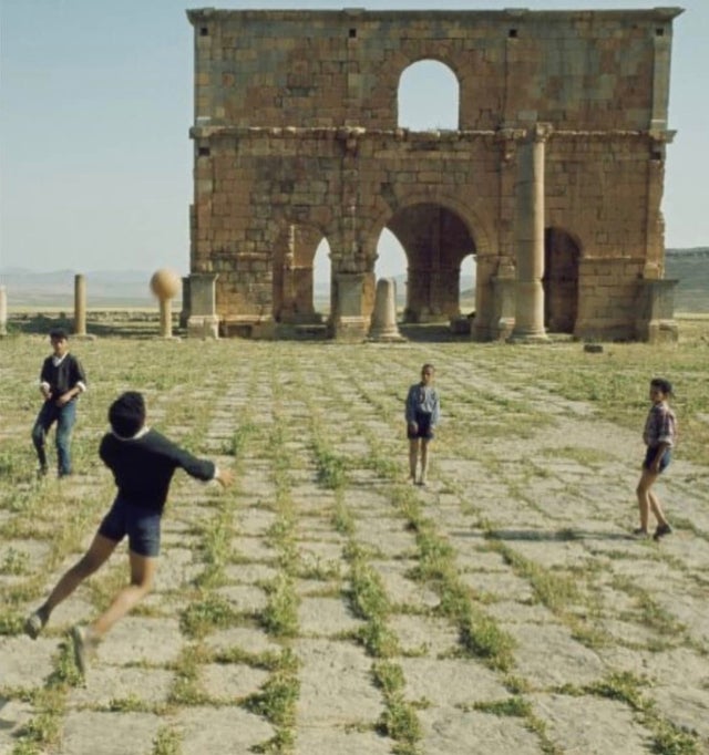 1968_kids_playing_near_roman_ruins_in_batna_algeria.jpg