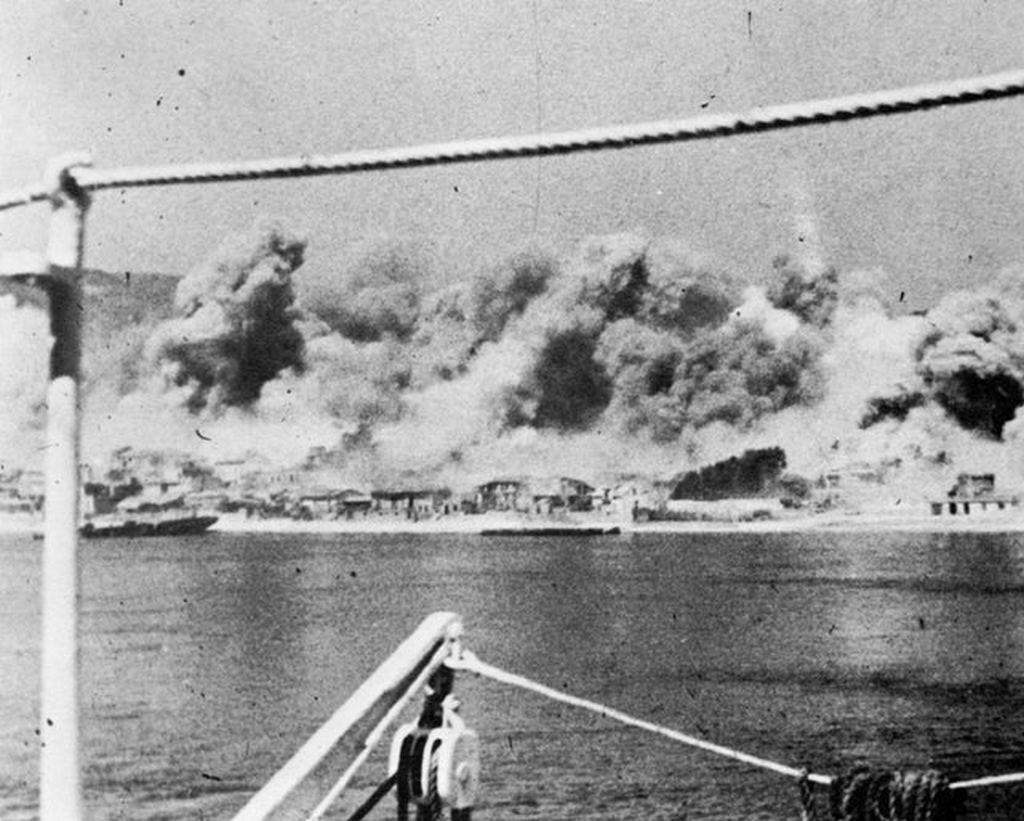 1943_nyara_a_bombing_raid_on_messina_sicily_seen_from_a_ship_moored_in_the_harbour.jpg