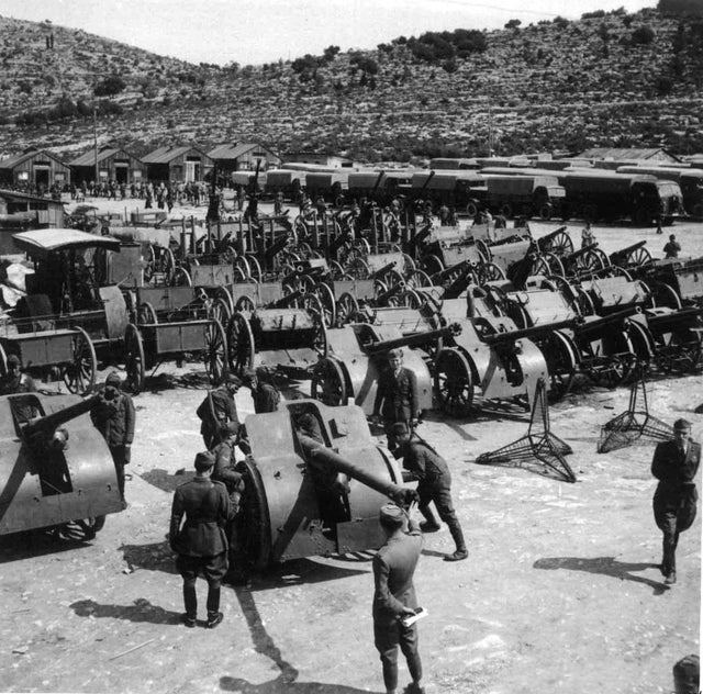 1941_italian_troops_inspecting_captured_artillery_and_equipment_after_the_invasion_of_yugoslavia.jpg