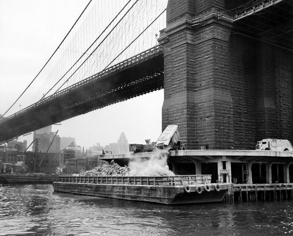 1949_garbage_was_dumped_onto_a_scow_at_the_base_of_the_brooklyn_bridge_on_its_way_to_staten_island_where_city_landfill.jpg