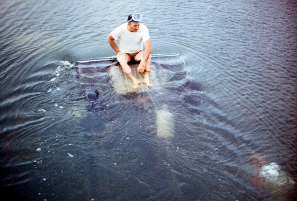 1969_edgartown_police_chief_sits_on_the_oldsmobile_driven_by_ted_kennedy_at_dike_bridge_on_chappaquiddick_island_while_diver_examines_the_back_seat_where_he_discover_the_deceased_body_of_mary_jo_kopechne.jpg