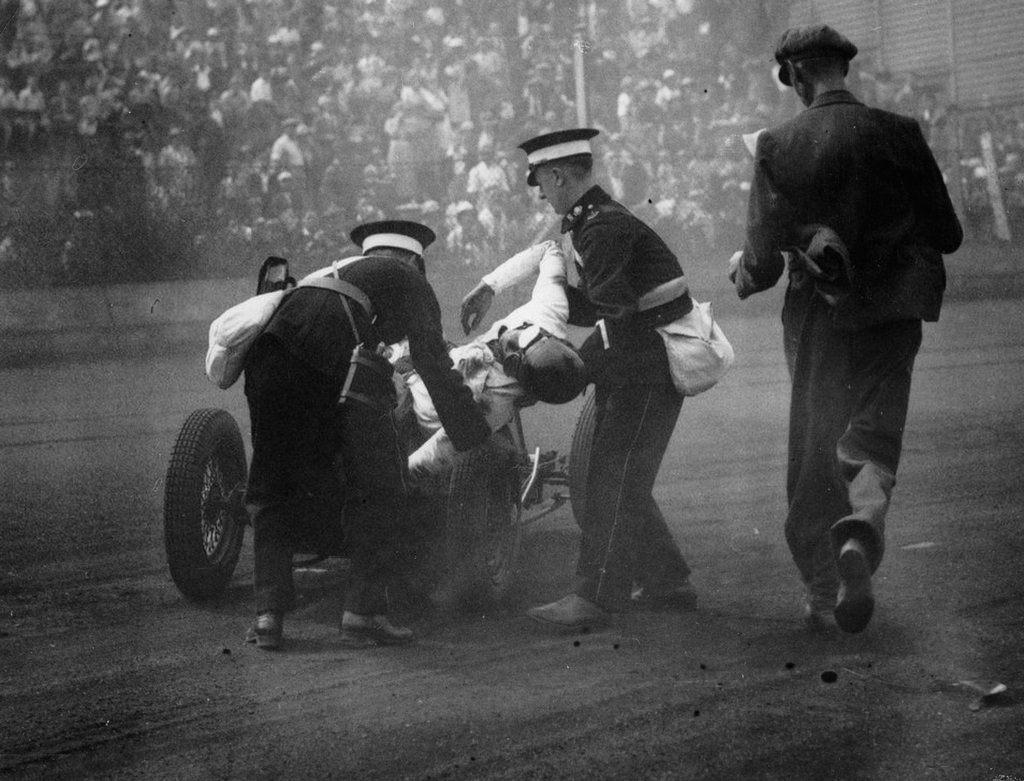 1935_paramedics_lifting_the_badly_injured_driver_after_an_accident_out_of_the_racing_car_london_england.jpg