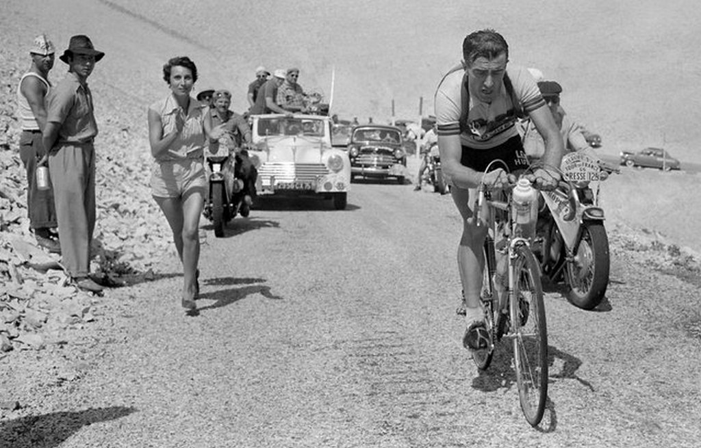 1955_french_louison_bobet_cheered_on_by_his_wife_christiane_climbs_the_mont_ventoux_on_his_way_to_winning_the_11th_stage_of_the_tour_de_france_between_marseille_and_avignon.jpeg