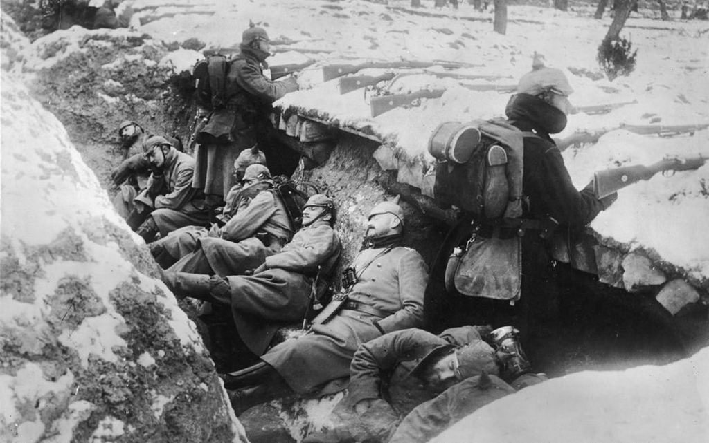 1914_german_soldiers_sleeping_in_snowy_trenches_as_two_guards_stand_with_their_rifles_poised_near_the_aisne_river_valley_france.jpg