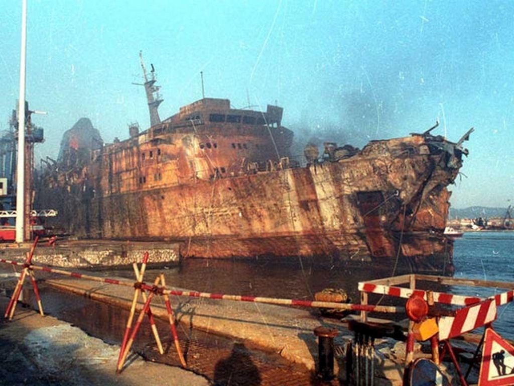 1991_the_burned_italian_ferry_moby_prince_is_towed_into_port_after_her_fatal_collision_with_the_oil_tanker_agip_abruzzo_140_killed_with_one_survivor.jpg