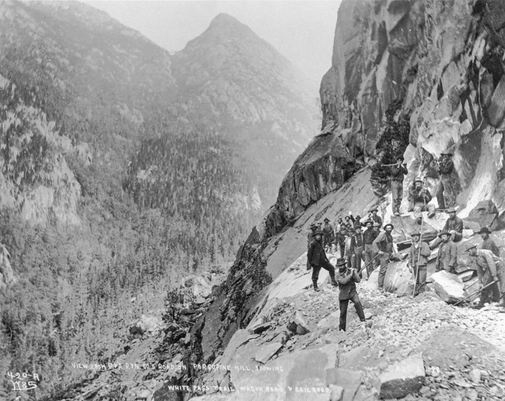 1898_building_of_the_railway_through_the_white_pass_trail_british_columbia.png