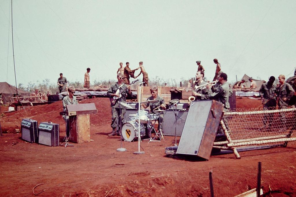 1969_a_group_of_soldiers_create_a_band_and_put_on_a_show_at_their_base_camp_in_cambodia.jpg