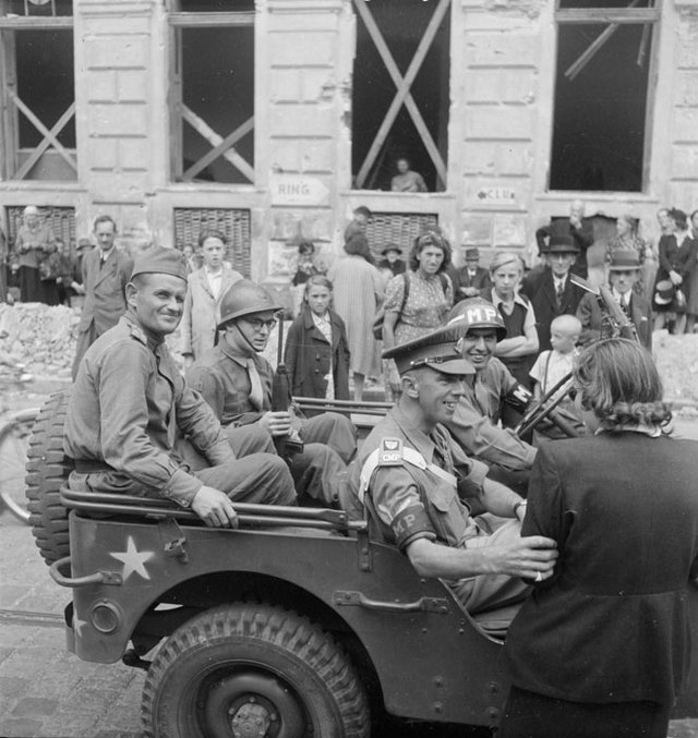 1945_a_soviet_a_french_a_british_and_an_american_in_a_jeep_car_vienna.jpg