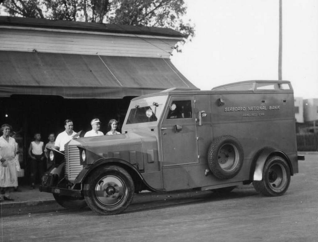 1929_los_angeles_ca_street_corner_customers_do_their_banking_with_a_roving_teller_who_sits_inside_a_seaboard_national_bank_armored_car.jpg