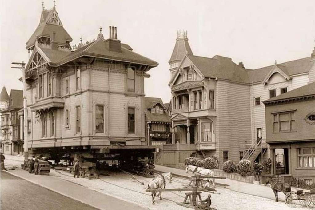1908_a_victorian_home_being_moved_on_steiner_street_via_horse_power_san_francisco.jpg