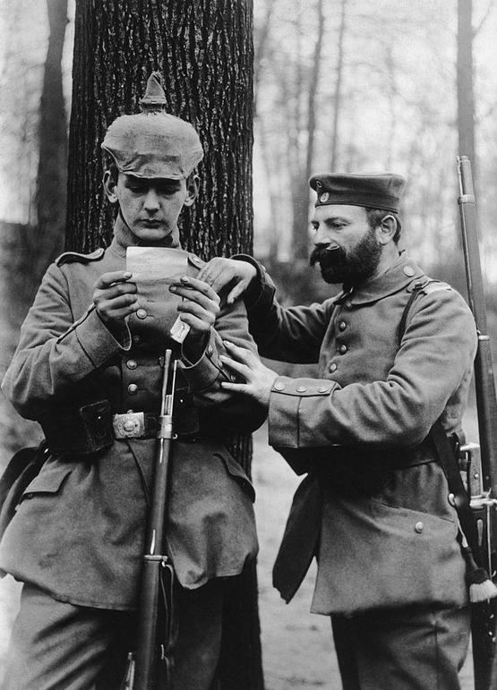 1915_father_and_son_from_the_same_german_regiment_read_a_letter_from_their_respective_wife_and_mother_at_the_front.jpg